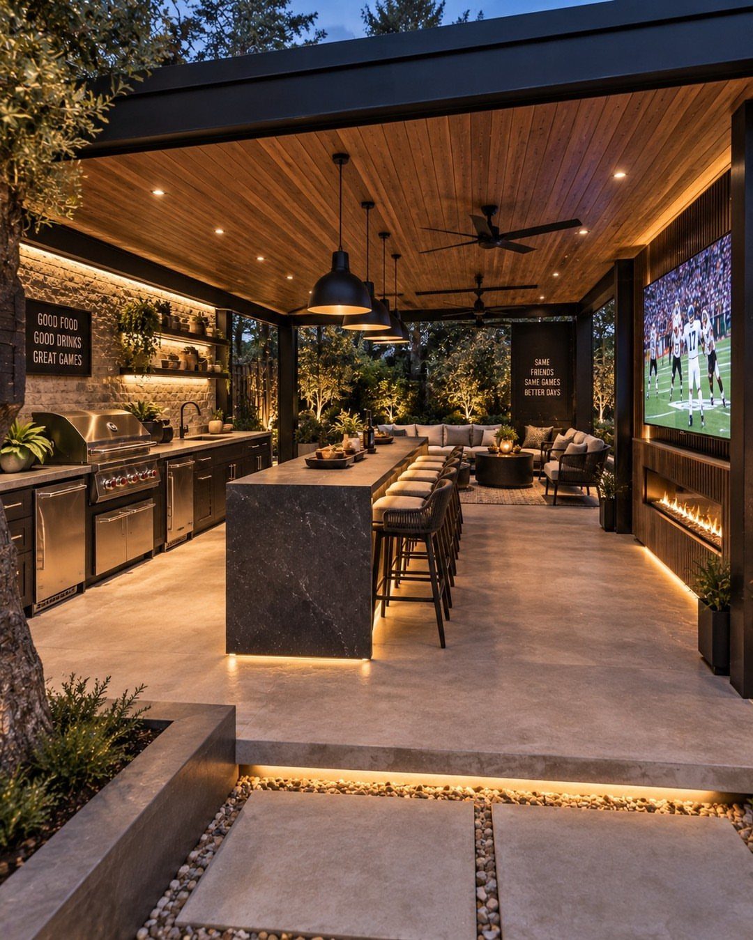 Backyard Barbeque Design: 12 BBQ Island Ideas for Outdoor Cooking 2 A long dark stone BBQ island with extended countertops and bar stools in a modern outdoor kitchen.