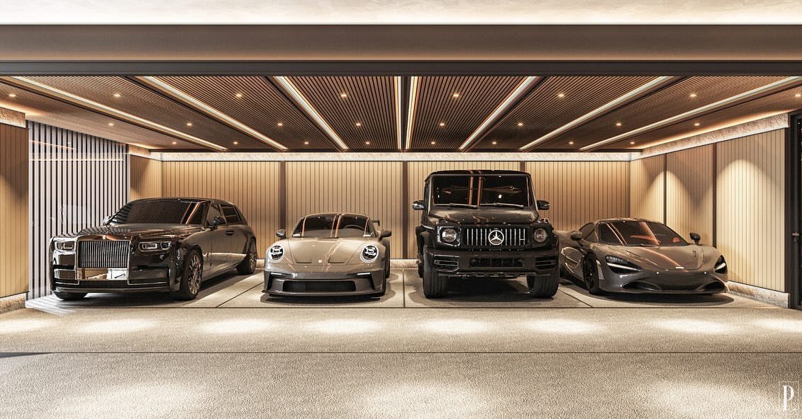 9 Garage Design Interior Ideas for Workspace, Storage and Style 7 Four luxury cars parked in a modern garage with wood slat ceilings and warm accent lighting.