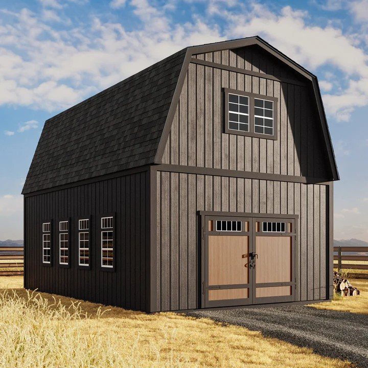 9 Modern Farmhouse Shed Ideas for Your Backyard 5 Black two-story farmhouse shed with a gambrel roof and wooden double doors in a field.