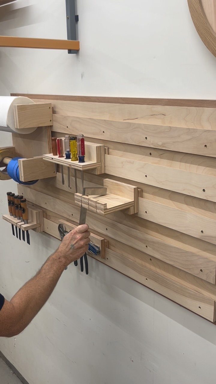 Tool Shed Storage: 12 Ideas for Lawn Gear, Power Tools & Hardware 10 A hand reaches for a tool mounted on a wooden French cleat storage system.