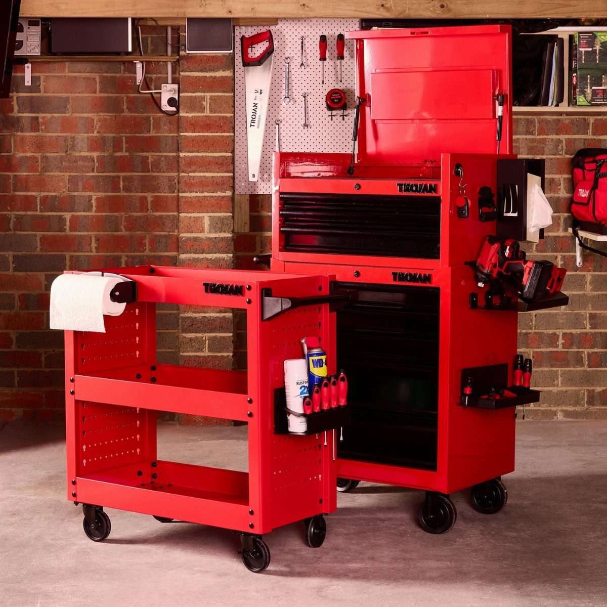 Tool Shed Storage: 12 Ideas for Lawn Gear, Power Tools & Hardware 4 Two red metal rolling utility carts positioned in a garage against a brick wall.